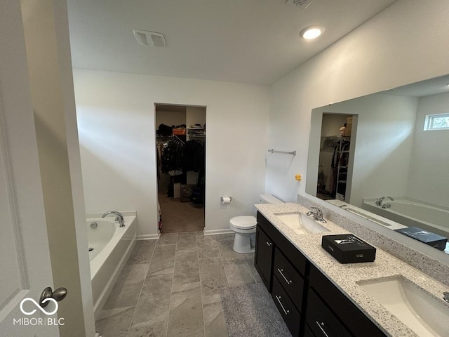 1573 Vera Blvd, Danville, IN 46122 - full bathroom with double vanity, a garden tub, and a sink