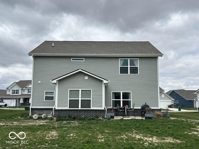 1573 Vera Blvd, Danville, IN 46122 - rear view of house featuring a patio area and a lawn