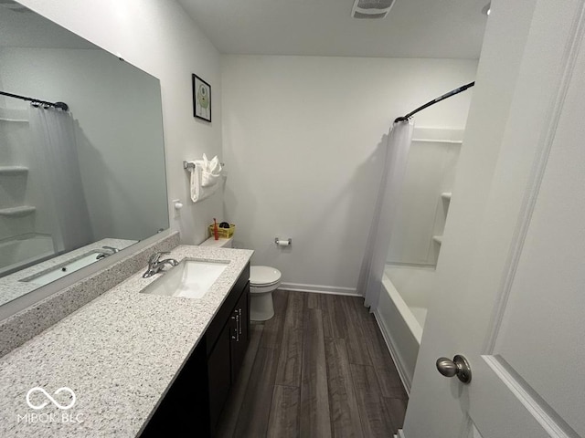 1573 Vera Blvd, Danville, IN 46122 - full bathroom with visible vents, toilet, shower / bathtub combination with curtain, vanity, and wood finished floors