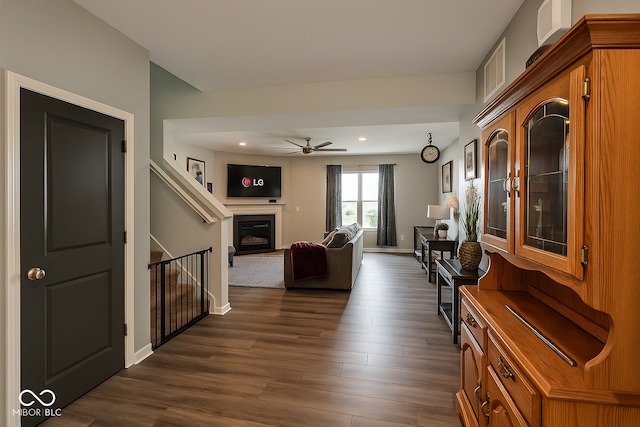 1573 Vera Blvd, Danville, IN 46122 - living room with dark wood-style flooring, a glass covered fireplace, ceiling fan, and recessed lighting