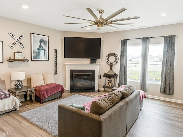 1573 Vera Blvd, Danville, IN 46122 - living area with ceiling fan, wood finished floors, recessed lighting, and a fireplace with flush hearth