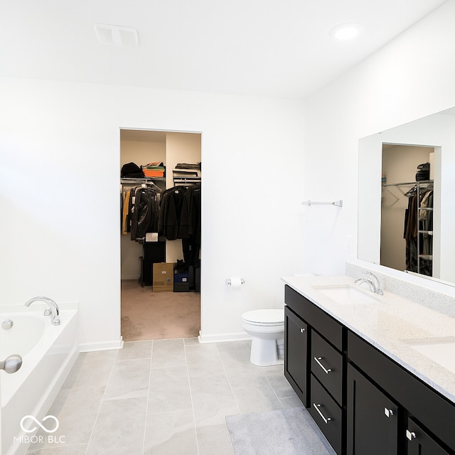 1573 Vera Blvd, Danville, IN 46122 - bathroom featuring a spacious closet, double vanity, a bath, and tile patterned floors