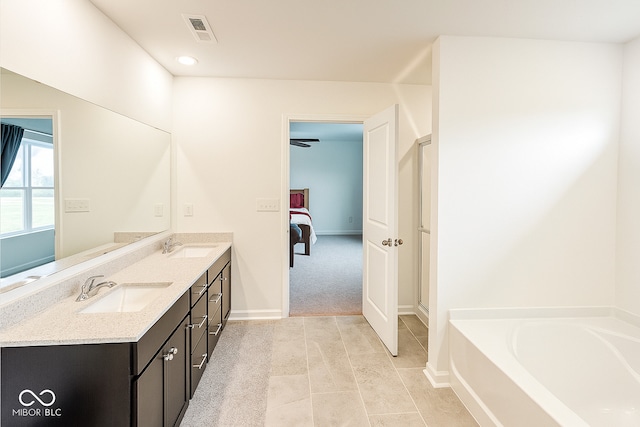 1573 Vera Blvd, Danville, IN 46122 - ensuite bathroom with double vanity, a bath, tile patterned floors, and recessed lighting