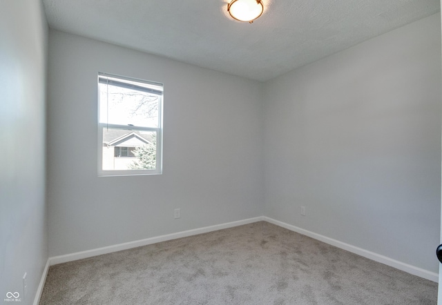 1125 N Colorado Ave, Indianapolis, IN 46201 - carpeted empty room featuring baseboards