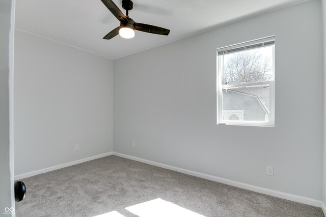 1125 N Colorado Ave, Indianapolis, IN 46201 - carpeted empty room with baseboards and ceiling fan