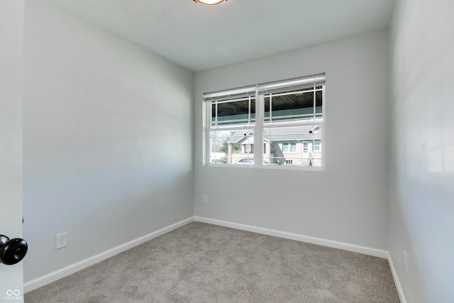 1125 N Colorado Ave, Indianapolis, IN 46201 - carpeted spare room with baseboards