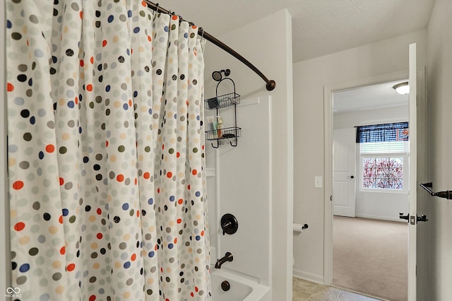 16758 Bingham Dr, Westfield, IN 46074 - full bathroom featuring tile patterned floors, baseboards, and shower / tub combo with curtain