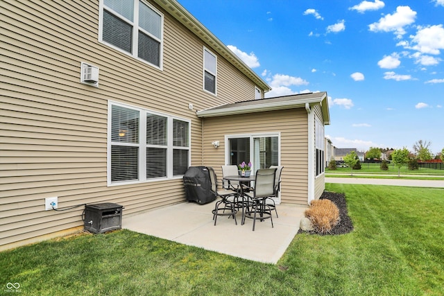 16758 Bingham Dr, Westfield, IN 46074 - rear view of house with a patio area, a wall unit AC, and a lawn