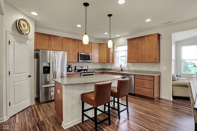 16758 Bingham Dr, Westfield, IN 46074 - kitchen with visible vents, recessed lighting, a center island, appliances with stainless steel finishes, and dark wood-style flooring
