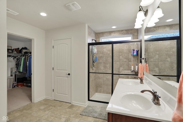 16758 Bingham Dr, Westfield, IN 46074 - bathroom with visible vents, a sink, and a stall shower