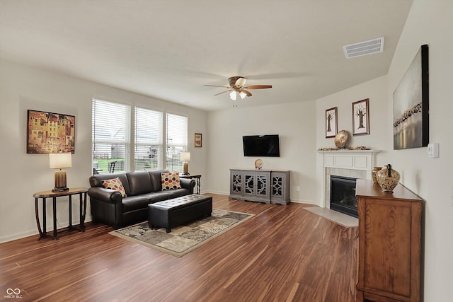 16758 Bingham Dr, Westfield, IN 46074 - living room featuring a fireplace, visible vents, dark wood-style flooring, and a ceiling fan