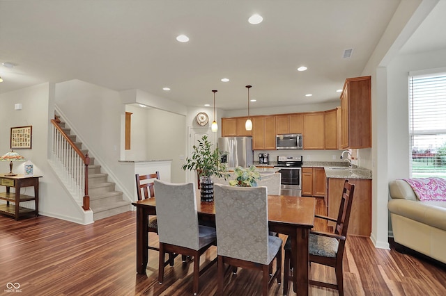 16758 Bingham Dr, Westfield, IN 46074 - dining area featuring recessed lighting, dark wood-style floors, baseboards, and stairs