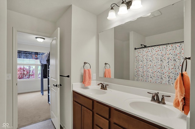 16758 Bingham Dr, Westfield, IN 46074 - full bath with curtained shower, double vanity, a sink, and tile patterned flooring