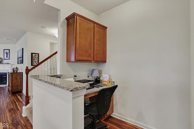 16758 Bingham Dr, Westfield, IN 46074 - home office featuring dark wood-type flooring, visible vents, baseboards, and built in desk