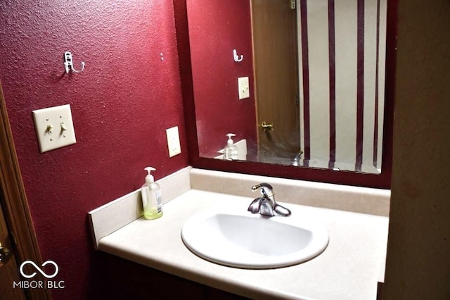 607 Deer Trail Dr, Indianapolis, IN 46217 - bathroom with vanity and a textured wall