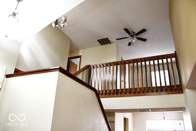 607 Deer Trail Dr, Indianapolis, IN 46217 - stairs with high vaulted ceiling, ceiling fan, and visible vents