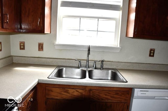 607 Deer Trail Dr, Indianapolis, IN 46217 - kitchen featuring light countertops, a sink, and dishwashing machine