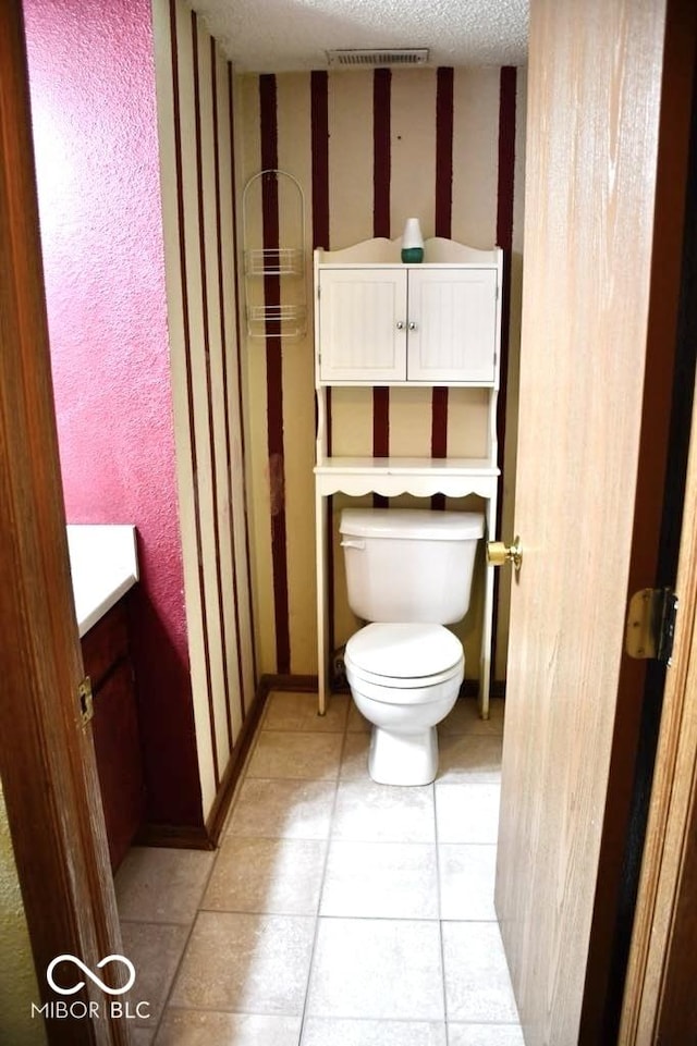 607 Deer Trail Dr, Indianapolis, IN 46217 - bathroom with toilet, tile patterned floors, and vanity