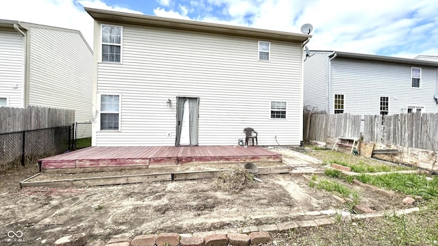 607 Deer Trail Dr, Indianapolis, IN 46217 - back of property with a fenced backyard and a deck