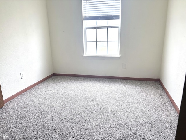 607 Deer Trail Dr, Indianapolis, IN 46217 - spare room featuring baseboards and carpet floors