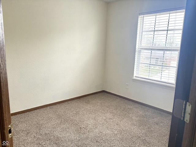 607 Deer Trail Dr, Indianapolis, IN 46217 - carpeted empty room with baseboards