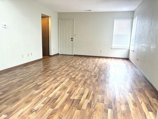 607 Deer Trail Dr, Indianapolis, IN 46217 - spare room featuring visible vents and wood finished floors