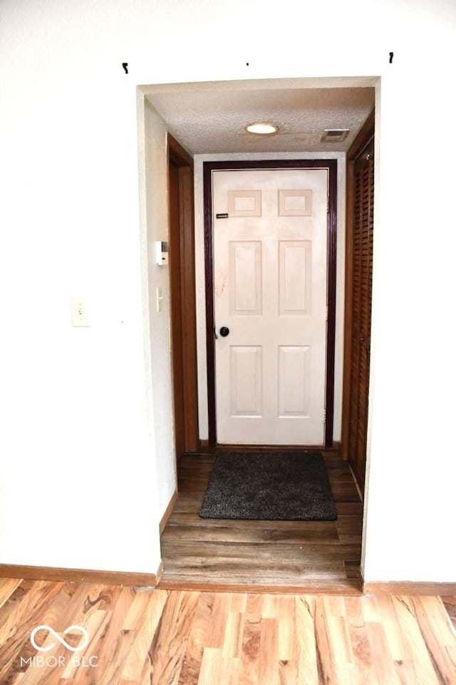 607 Deer Trail Dr, Indianapolis, IN 46217 - entryway with baseboards and wood finished floors
