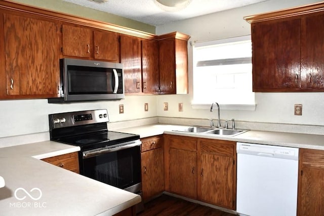 607 Deer Trail Dr, Indianapolis, IN 46217 - kitchen featuring a sink, light countertops, and stainless steel appliances