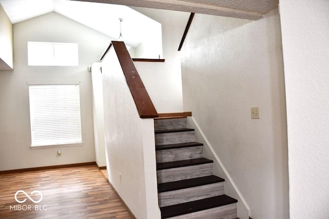 607 Deer Trail Dr, Indianapolis, IN 46217 - stairway with wood finished floors, baseboards, and lofted ceiling