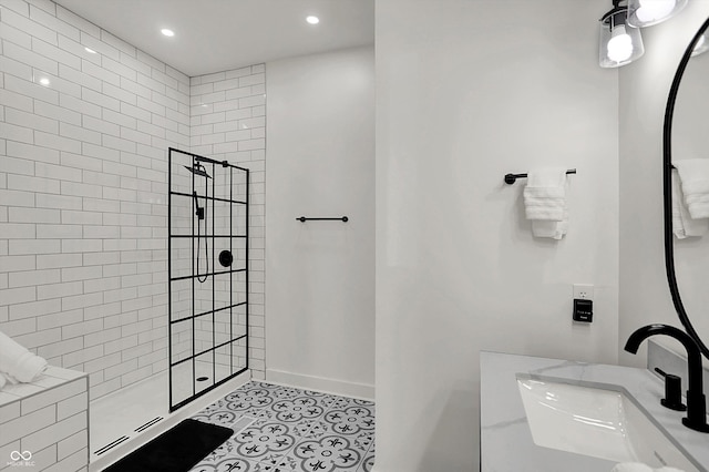 1818 Orleans St, Indianapolis, IN 46203 - bathroom featuring a sink, a walk in shower, baseboards, and recessed lighting