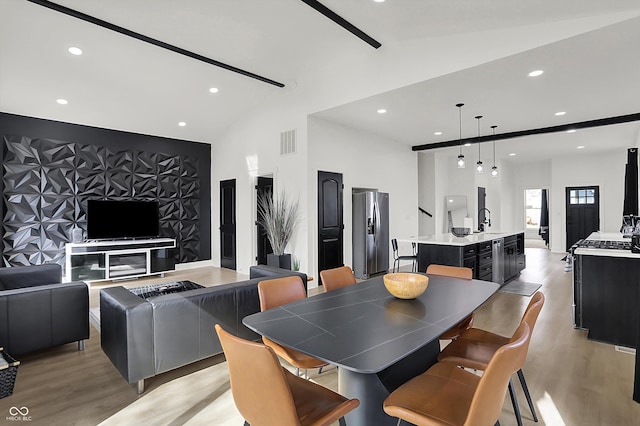 1818 Orleans St, Indianapolis, IN 46203 - dining room featuring light wood-style floors, recessed lighting, visible vents, and high vaulted ceiling