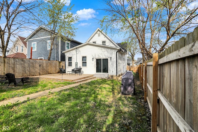 1818 Orleans St, Indianapolis, IN 46203 - rear view of property with a lawn, a fenced backyard, and a wooden deck
