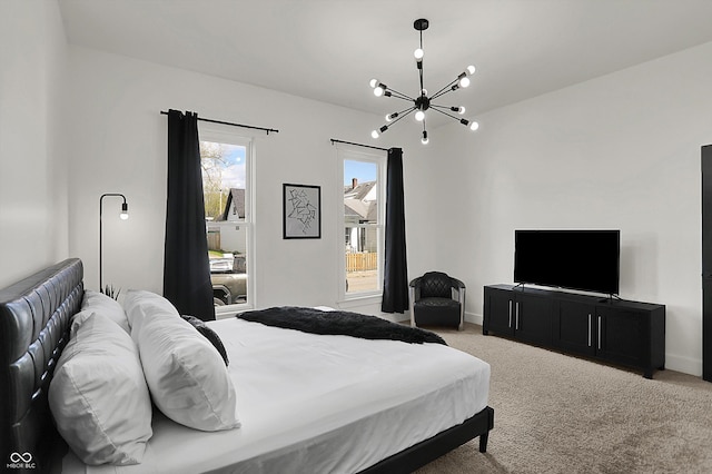 1818 Orleans St, Indianapolis, IN 46203 - carpeted bedroom with baseboards and a notable chandelier