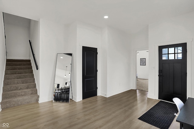 1818 Orleans St, Indianapolis, IN 46203 - entrance foyer with stairs, recessed lighting, baseboards, wood finished floors, and a towering ceiling