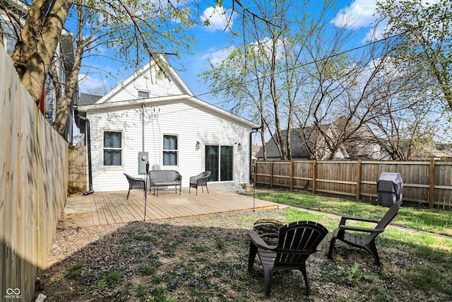 1818 Orleans St, Indianapolis, IN 46203 - rear view of property with a fenced backyard, a fire pit, and a deck