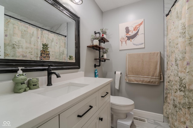 bathroom featuring marble finish floor, visible vents, toilet, vanity, and baseboards