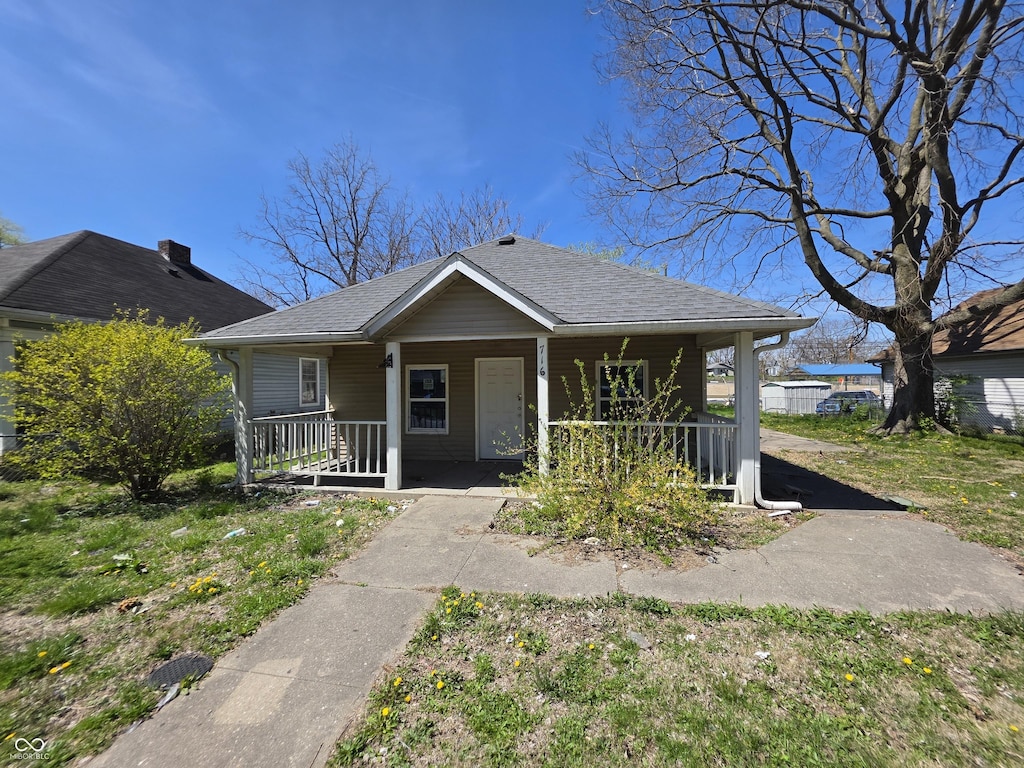 716 Lynn St, Indianapolis, IN 46222 - bungalow-style house with a porch and roof with shingles