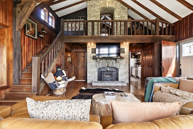 2790 W 50th St, Marion, IN 46953 - living room featuring high vaulted ceiling, wood walls, wood finished floors, beamed ceiling, and stairway