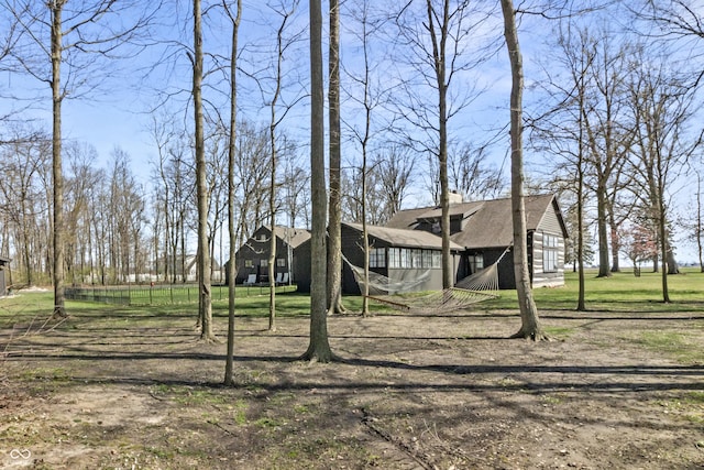 2790 W 50th St, Marion, IN 46953 - view of front of house featuring a shingled roof, a chimney, and a front lawn