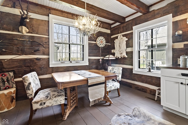 2790 W 50th St, Marion, IN 46953 - dining space featuring wooden walls, beamed ceiling, wood finished floors, and a chandelier