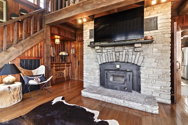 2790 W 50th St, Marion, IN 46953 - living area with wood walls, visible vents, and hardwood / wood-style floors