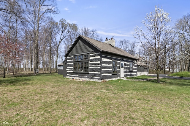 2790 W 50th St, Marion, IN 46953 - view of property exterior featuring a lawn and a chimney