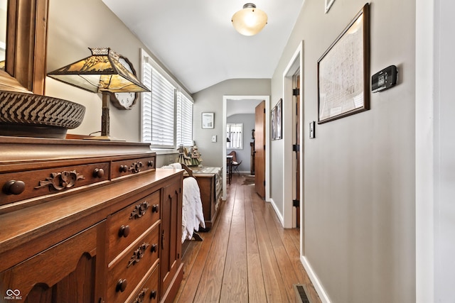 2790 W 50th St, Marion, IN 46953 - hall with visible vents, baseboards, light wood finished floors, and lofted ceiling