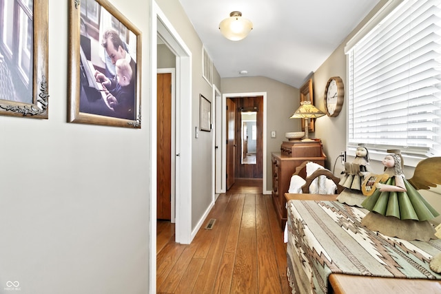 2790 W 50th St, Marion, IN 46953 - interior space featuring visible vents, baseboards, vaulted ceiling, and hardwood / wood-style floors