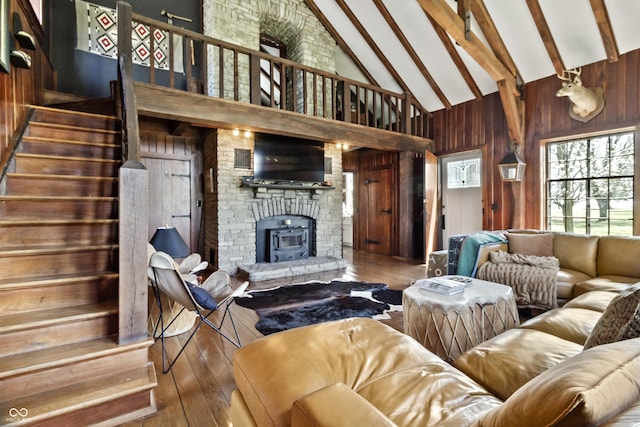 2790 W 50th St, Marion, IN 46953 - living area featuring wood-type flooring, wood walls, beamed ceiling, high vaulted ceiling, and stairway
