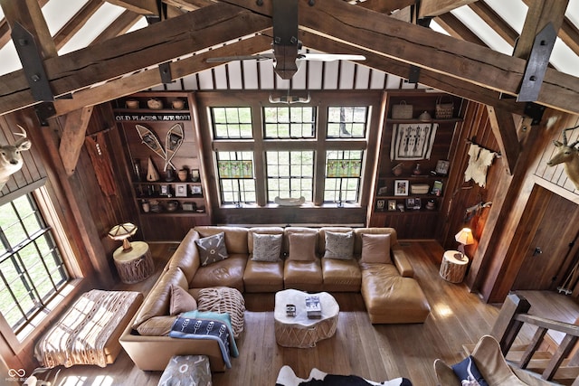 2790 W 50th St, Marion, IN 46953 - living room with lofted ceiling with beams, a ceiling fan, wood finished floors, and a wealth of natural light