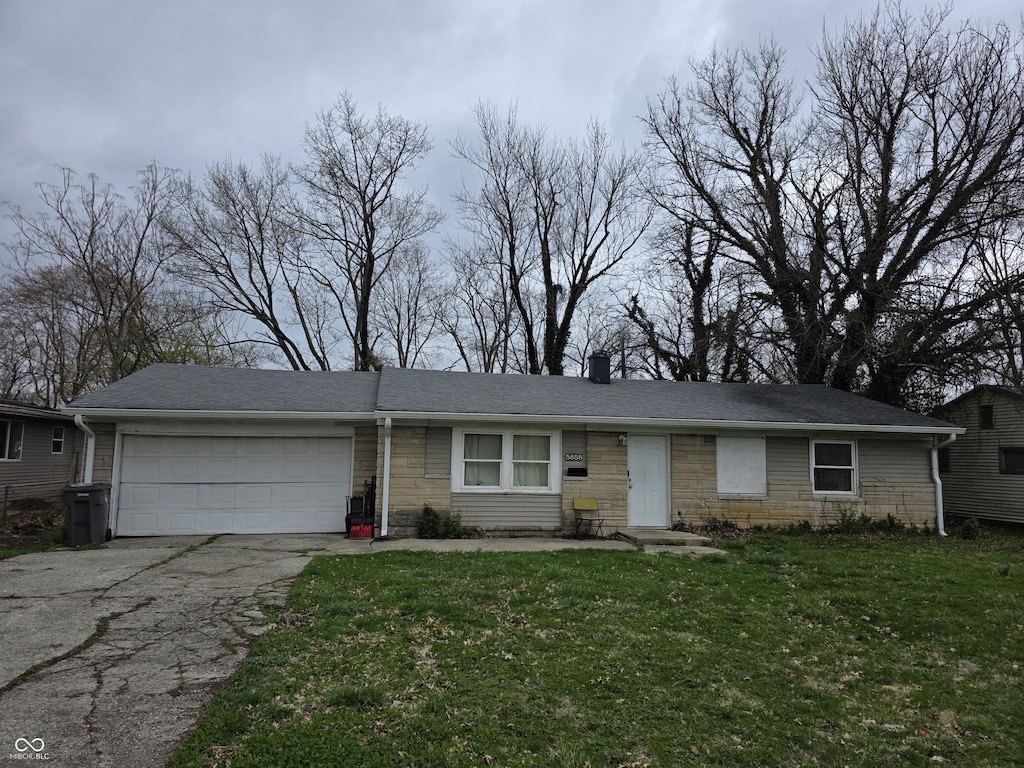 5858 E 44th St, Indianapolis, IN 46226 - ranch-style home with a garage, a front lawn, aphalt driveway, stone siding, and a chimney