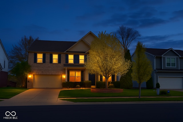 3724 Jonathan Rdg, Columbus, IN 47201 - view of front of property with a garage, concrete driveway, and a front lawn