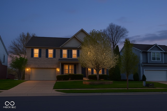 3724 Jonathan Rdg, Columbus, IN 47201 - traditional home featuring driveway, an attached garage, a yard, and brick siding