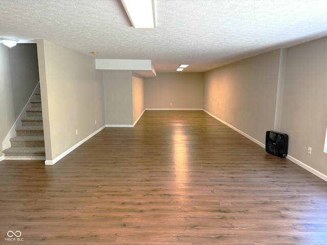 3724 Jonathan Rdg, Columbus, IN 47201 - finished below grade area with a textured ceiling, stairs, and wood finished floors